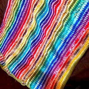 Homemade rainbow knitted blanket